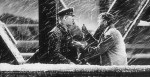 Frame from Its A Wonderful Life showing George Bailey on the bridge discovering Zuzus petals in his pocket.