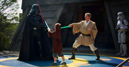 Photo of my son in a lightsaber duel with Darth Vader at Disney World