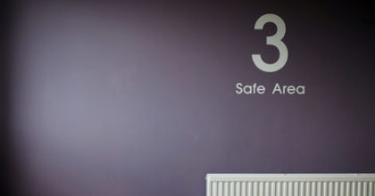 Photo of a wall with the sign '3 Safe Area'