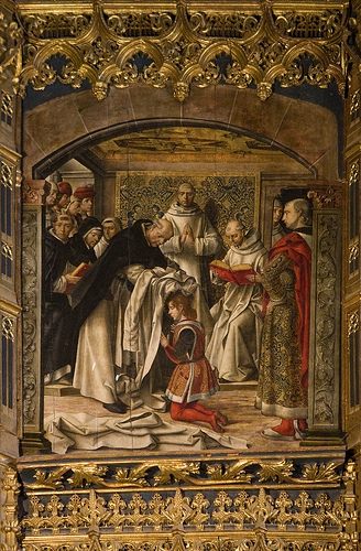St Thomas Aquinas is clothed in the Dominican habit.
