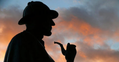 Backlit profile of Sherlock Holmes statue