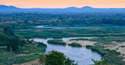 Photo of Pungwe River winding through lush valley in Gorongosa National Park
