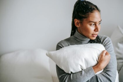 ethnic upset with sorrow expression on face